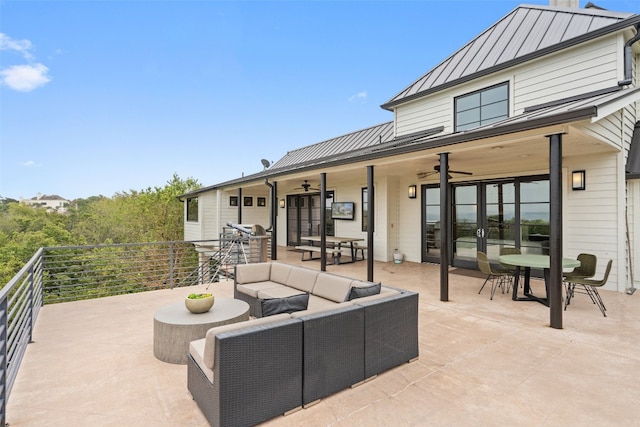 view of patio / terrace with a balcony, ceiling fan, and an outdoor living space