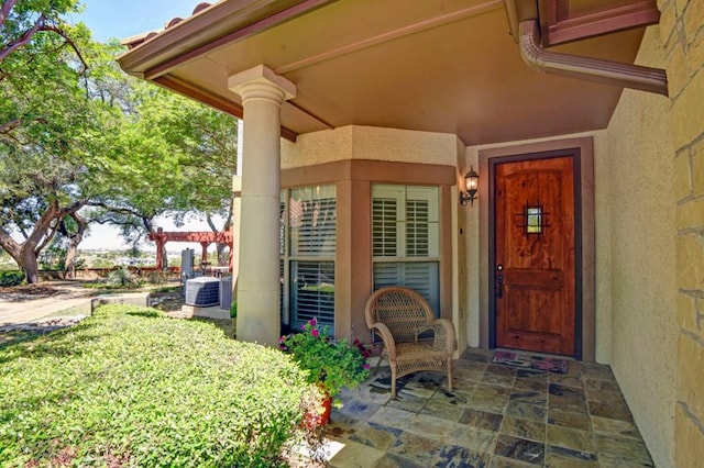 property entrance with central AC unit