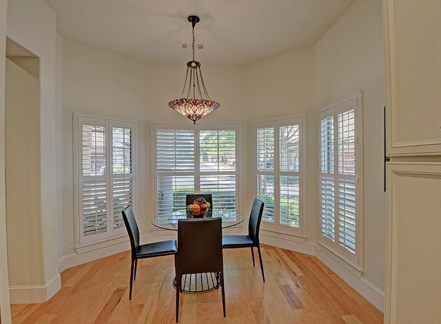 dining area with light hardwood / wood-style flooring