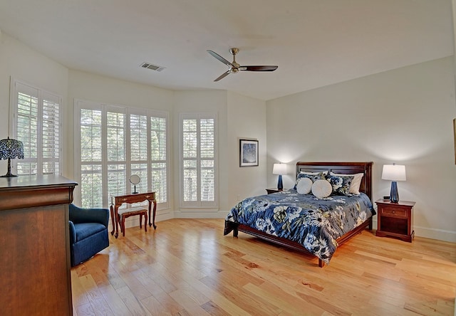 bedroom featuring light hardwood / wood-style floors and ceiling fan