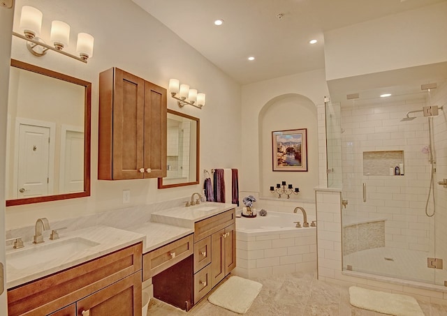 bathroom with tile patterned flooring, vanity, and plus walk in shower