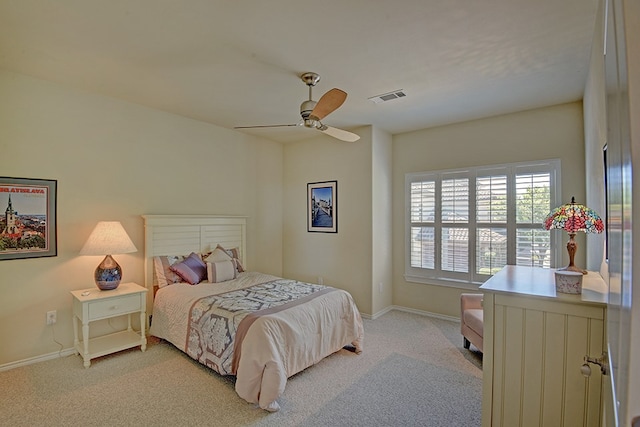 bedroom with light carpet and ceiling fan