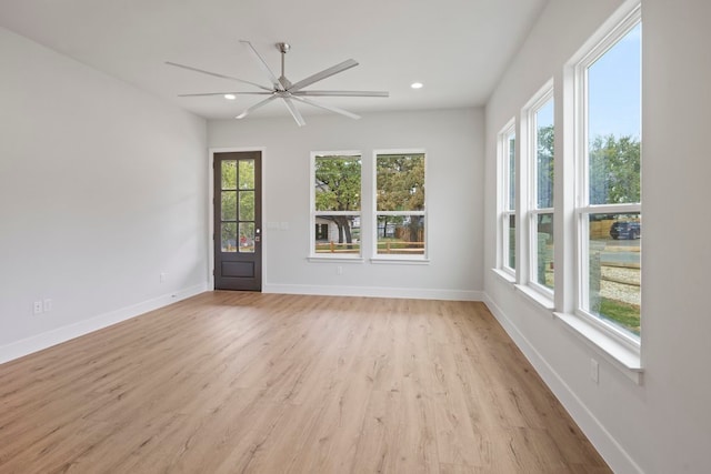 unfurnished room featuring ceiling fan and light hardwood / wood-style flooring