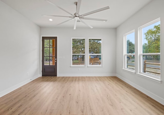 unfurnished room featuring light hardwood / wood-style floors and ceiling fan