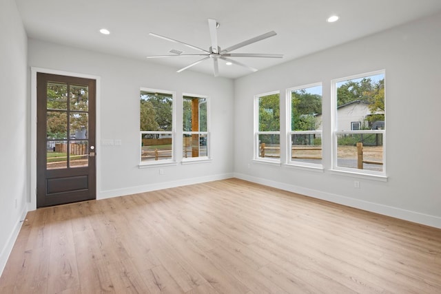 interior space featuring ceiling fan, light hardwood / wood-style floors, and plenty of natural light