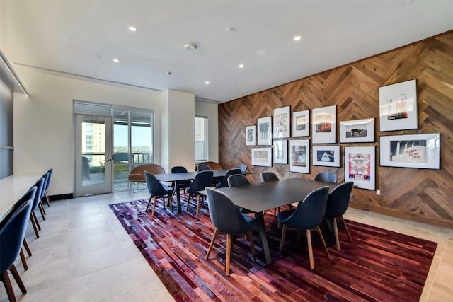 dining space with wood walls