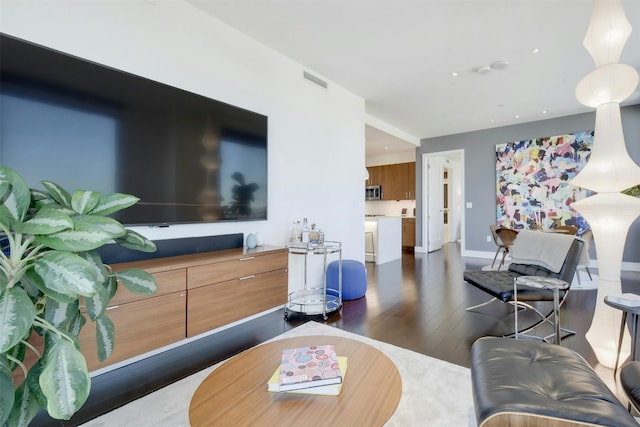 living room with dark hardwood / wood-style floors