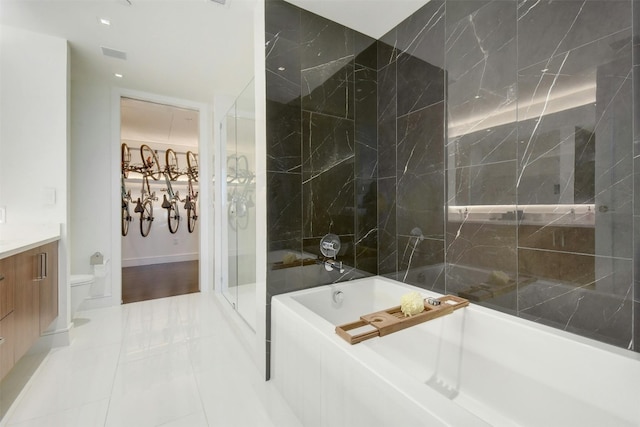 full bathroom featuring vanity, toilet, independent shower and bath, and tile patterned flooring