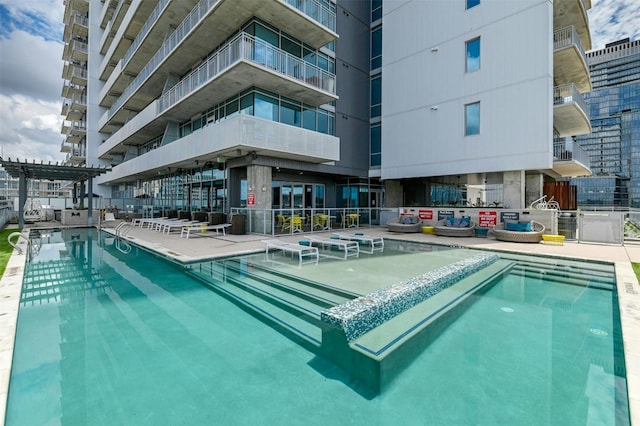 view of swimming pool featuring a patio