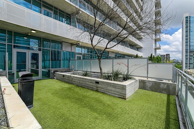 view of yard featuring a balcony