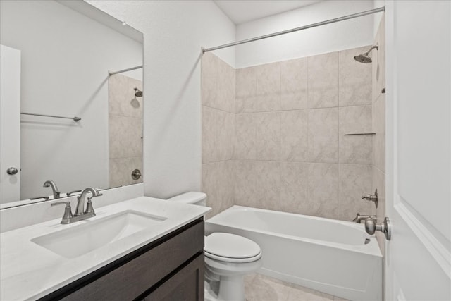 full bathroom featuring toilet, tiled shower / bath combo, and vanity