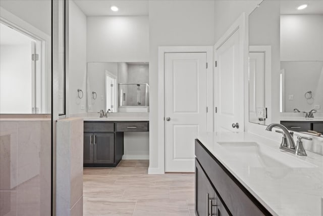 bathroom featuring vanity and a shower