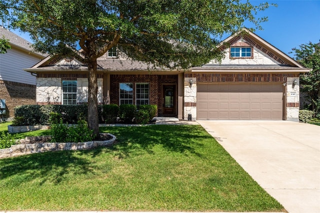 view of front of home featuring a front yard and a garage