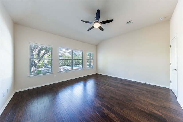 unfurnished room featuring vaulted ceiling, dark hardwood / wood-style floors, and ceiling fan