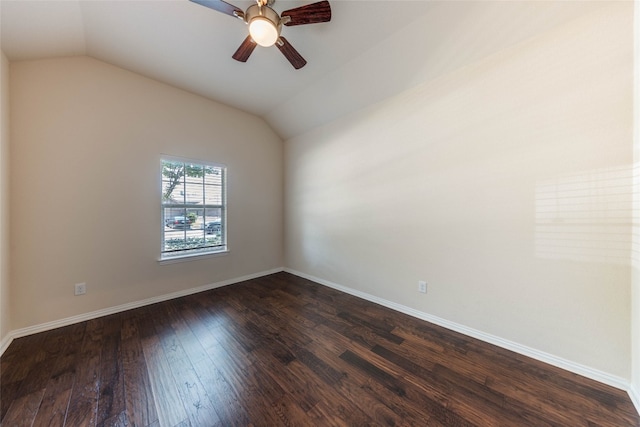 spare room featuring vaulted ceiling, dark hardwood / wood-style floors, and ceiling fan