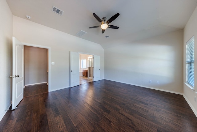 unfurnished bedroom with dark wood-type flooring, vaulted ceiling, and ceiling fan