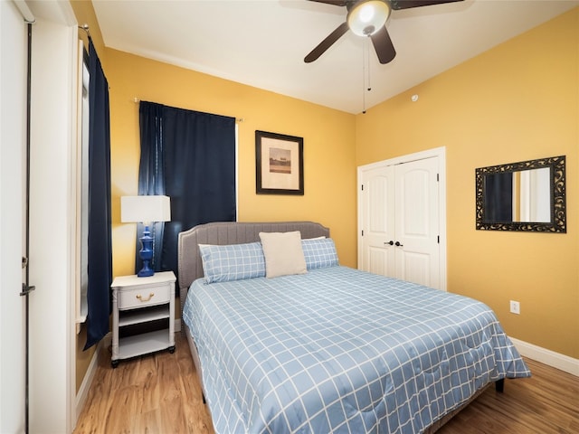 bedroom with a closet, ceiling fan, and wood-type flooring