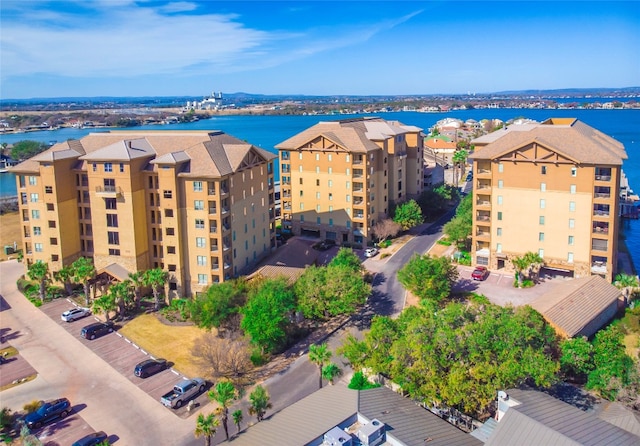 birds eye view of property with a water view