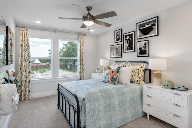 bedroom with light colored carpet and ceiling fan