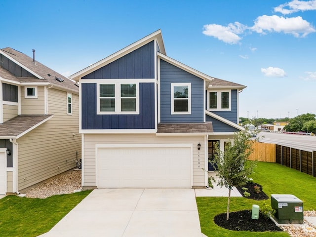 view of front facade featuring board and batten siding, driveway, fence, a front lawn, and an attached garage