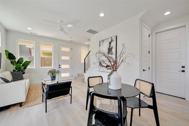 dining room with ceiling fan and light hardwood / wood-style flooring