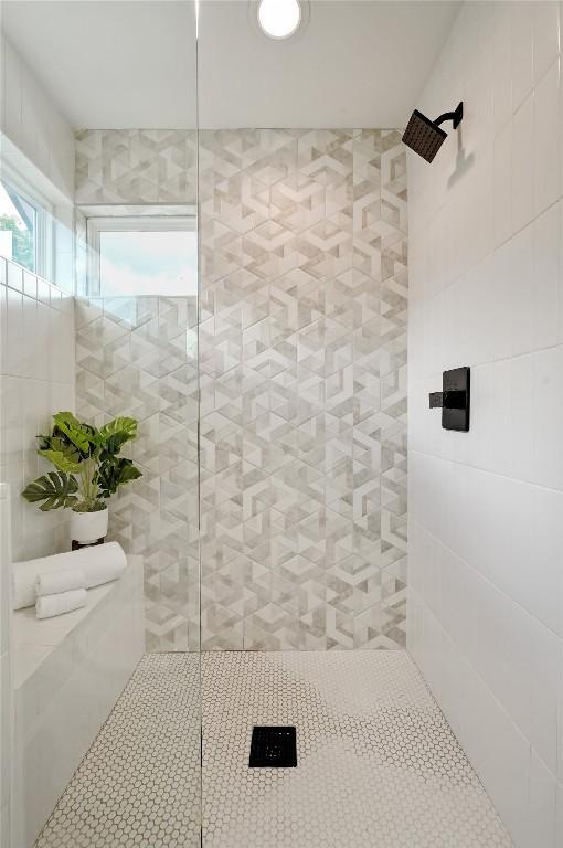 bathroom with tiled shower