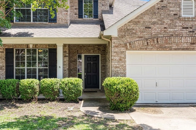 entrance to property featuring a garage