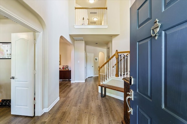 foyer entrance with hardwood / wood-style floors