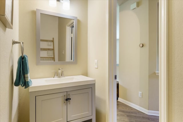 bathroom with vanity and hardwood / wood-style floors