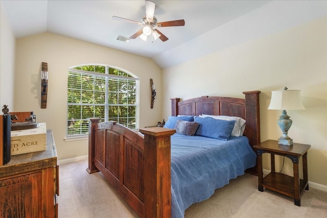 carpeted bedroom with ceiling fan and lofted ceiling