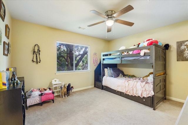 bedroom with light colored carpet and ceiling fan