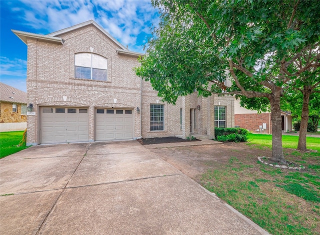 view of front of house with a front yard and a garage