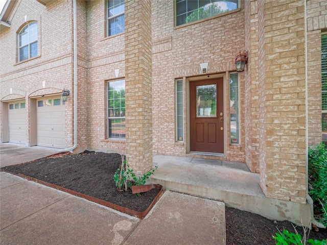 doorway to property featuring a garage