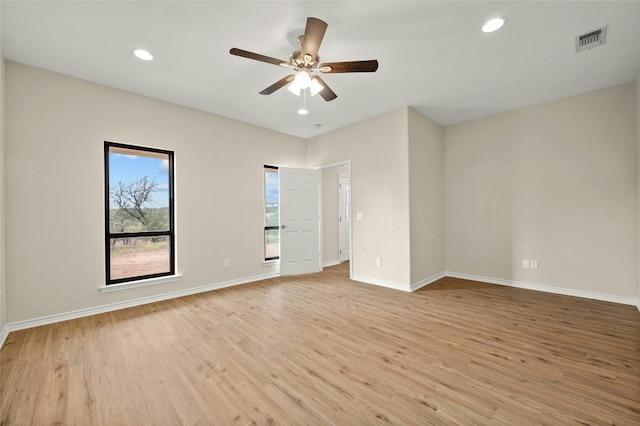 unfurnished room featuring ceiling fan and light hardwood / wood-style flooring