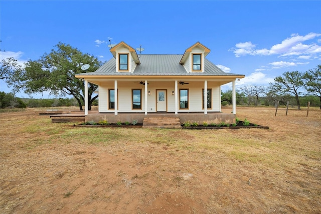 farmhouse inspired home featuring covered porch