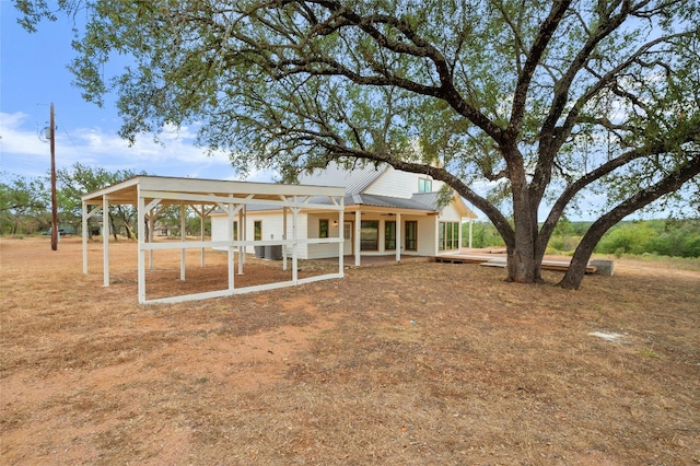 back of house with a patio