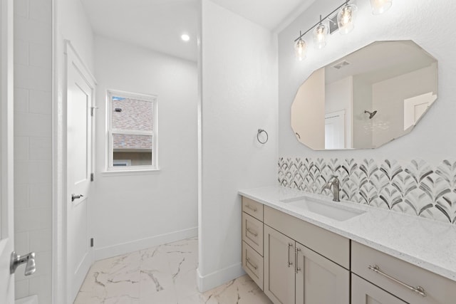 bathroom with a shower and vanity