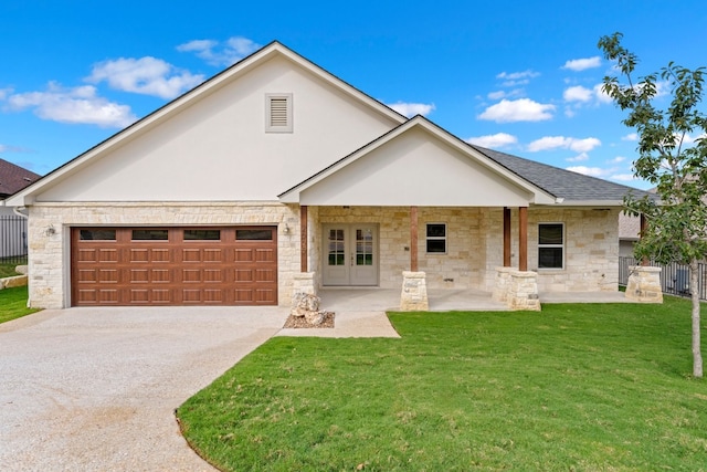 view of front facade with a garage and a front lawn