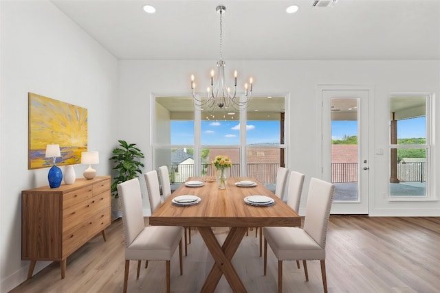 dining area featuring a chandelier and hardwood / wood-style flooring