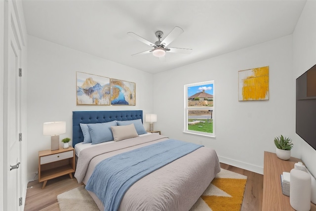 bedroom featuring wood-type flooring and ceiling fan