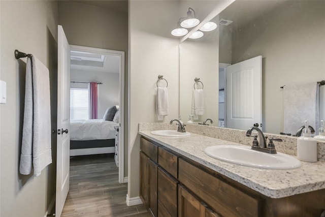 bathroom with vanity and hardwood / wood-style floors