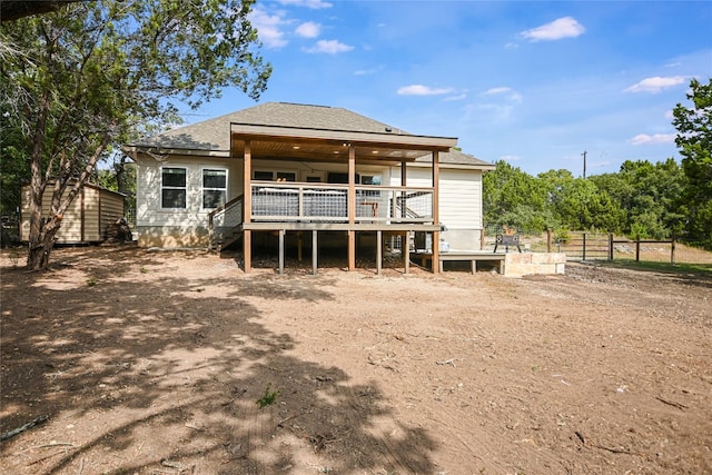 back of property featuring a deck