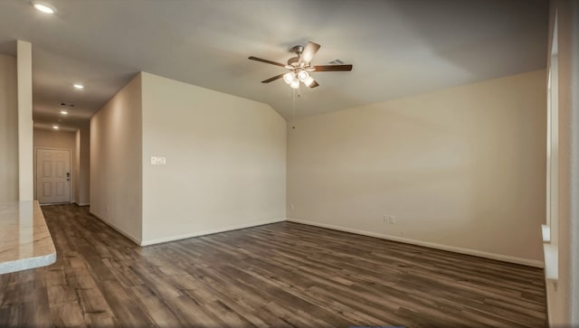 empty room featuring ceiling fan and dark hardwood / wood-style flooring