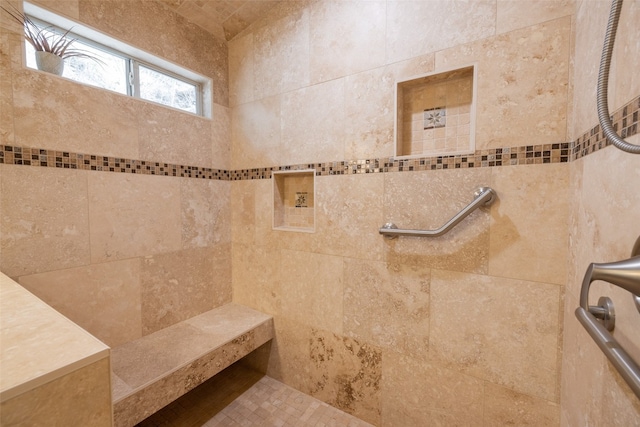 bathroom featuring tiled shower