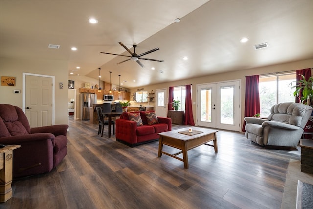 living room with french doors, dark hardwood / wood-style floors, ceiling fan, and vaulted ceiling