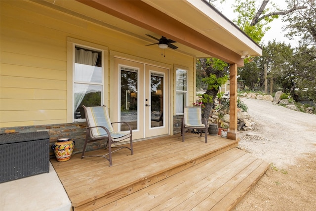 wooden deck featuring french doors and ceiling fan