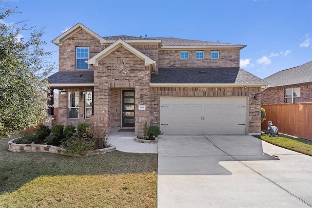 view of front facade featuring a front yard and a garage