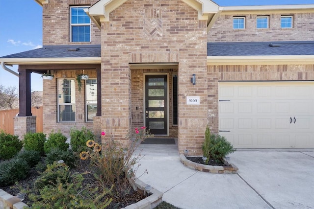 view of exterior entry featuring a garage