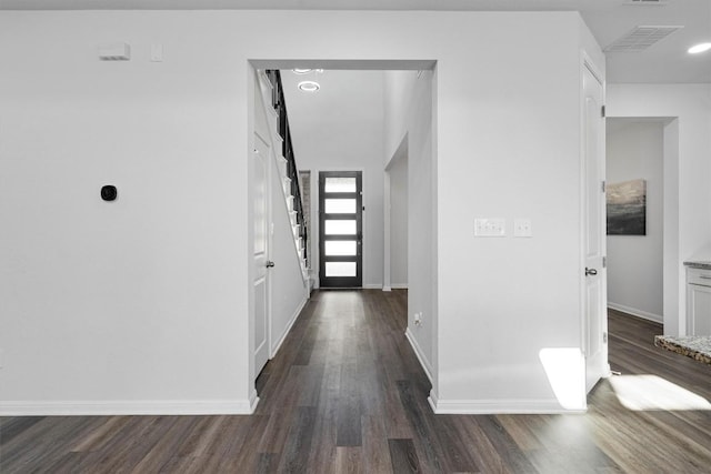 foyer entrance with dark hardwood / wood-style floors