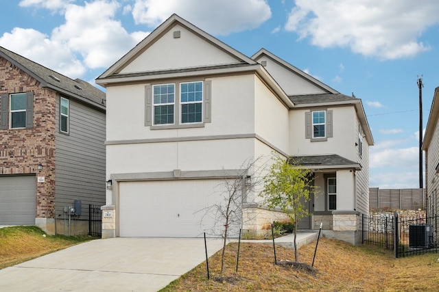 front of property featuring central AC unit and a garage